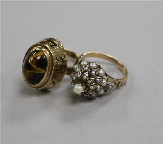 A 14ct and seed pearl ring and a 9ct gold and tigers eye quartz ring.